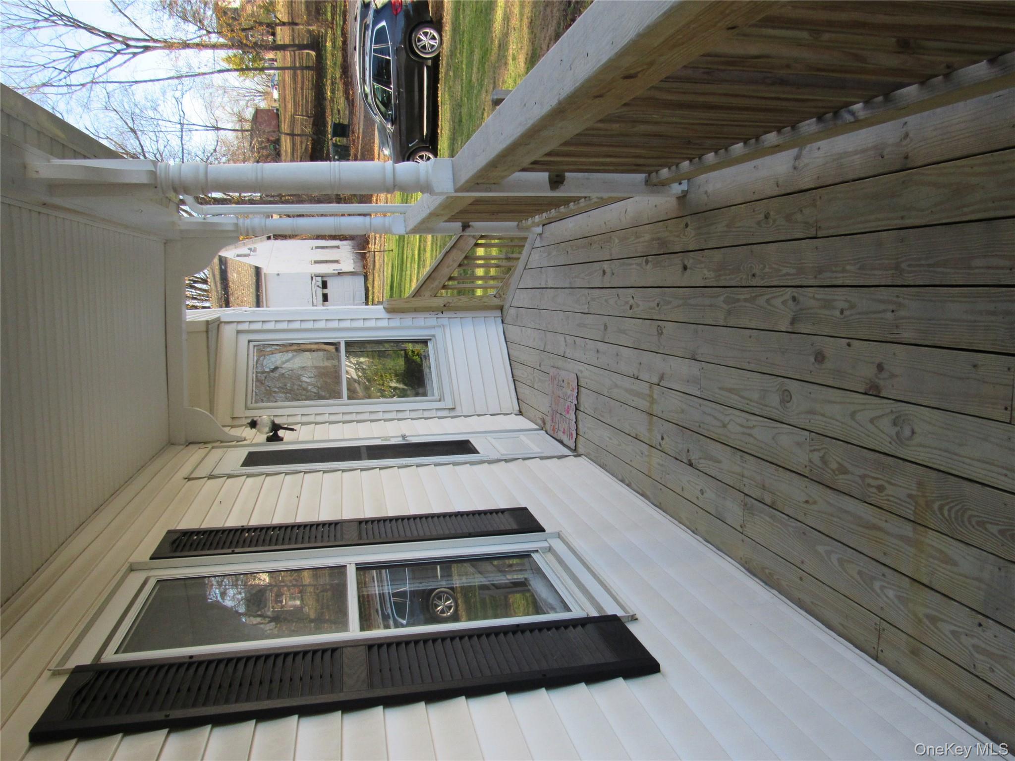 98 Main Street Chester, NY 10918 - Photo 5 of 29 a view of a balcony with wooden floor