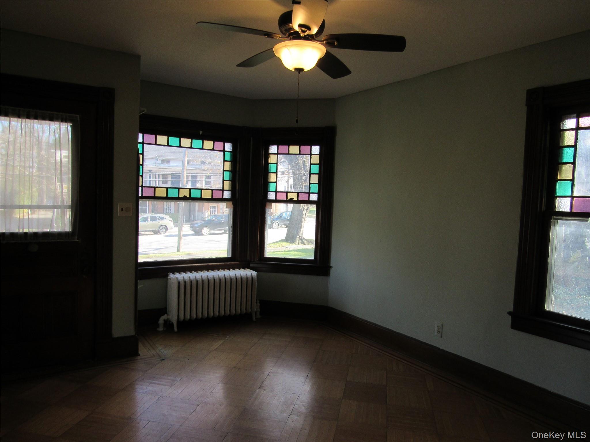 98 Main Street Chester, NY 10918 - Photo 6 of 29 a view of an empty room with window and chandelier fan