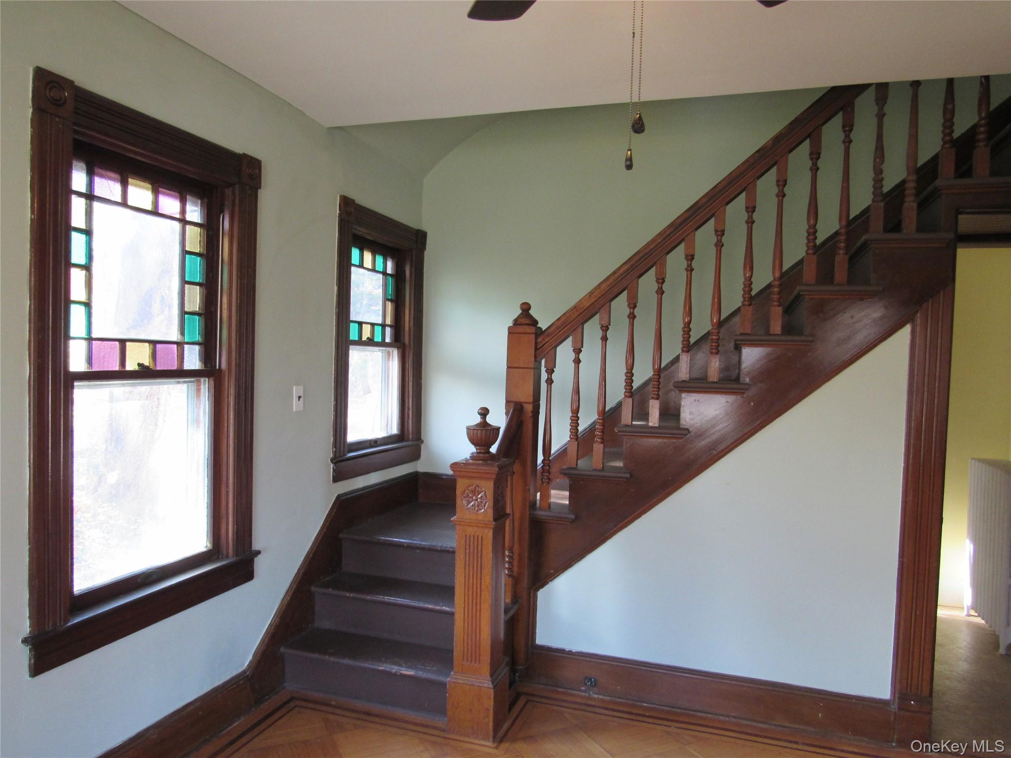 98 Main Street Chester, NY 10918 - Photo 9 of 32 Stairs with baseboards and a ceiling fan