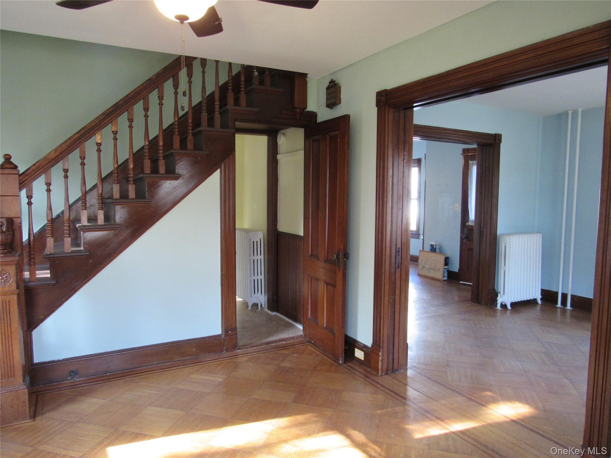 98 Main Street Chester, NY 10918 - Photo 10 of 32 Stairs featuring radiator and ceiling fan