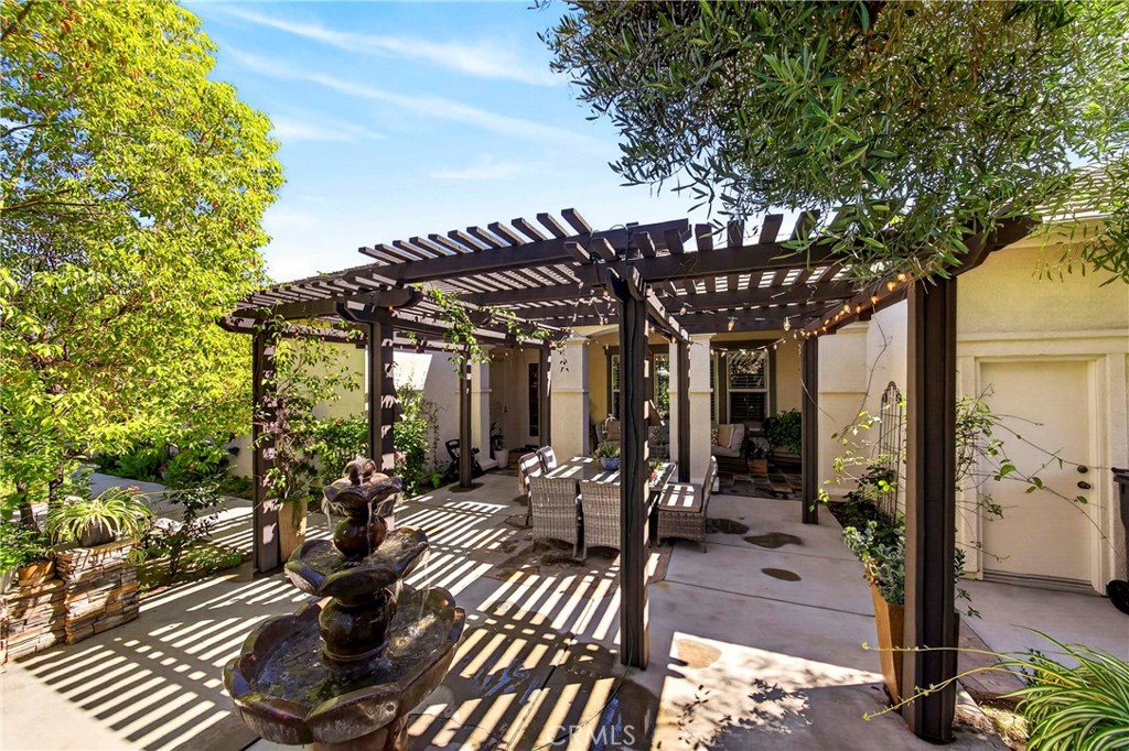 16375 Ory Circle Riverside, CA 92503 - Photo 49 of 51 a view of a patio with table and chairs potted plants and large tree