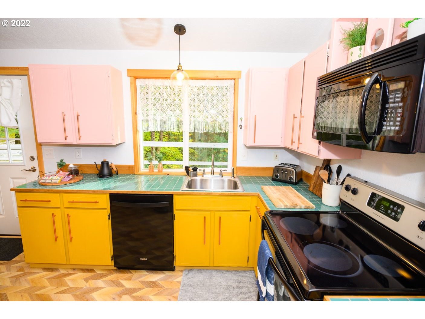 70406 East Terrace Drive Rhododendron, OR 97049 - Photo 11 of 32 a kitchen with a stove a sink and a microwave