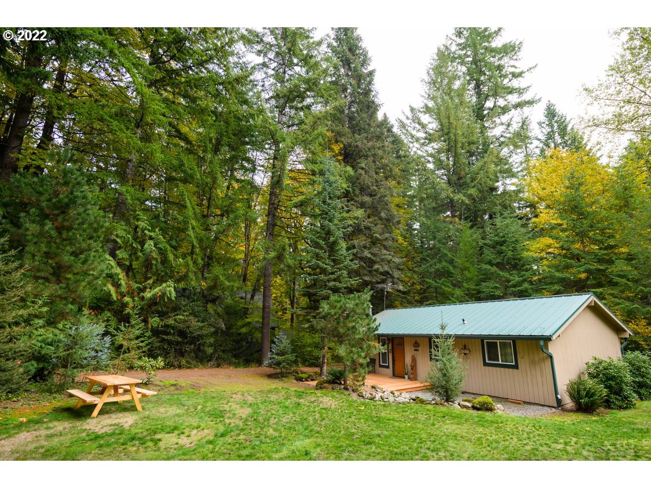 70406 East Terrace Drive Rhododendron, OR 97049 - Photo 2 of 32 a view of a house with a backyard