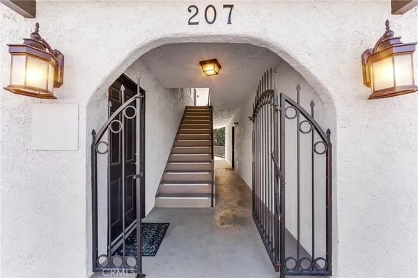a view of a entryway door with wooden floor