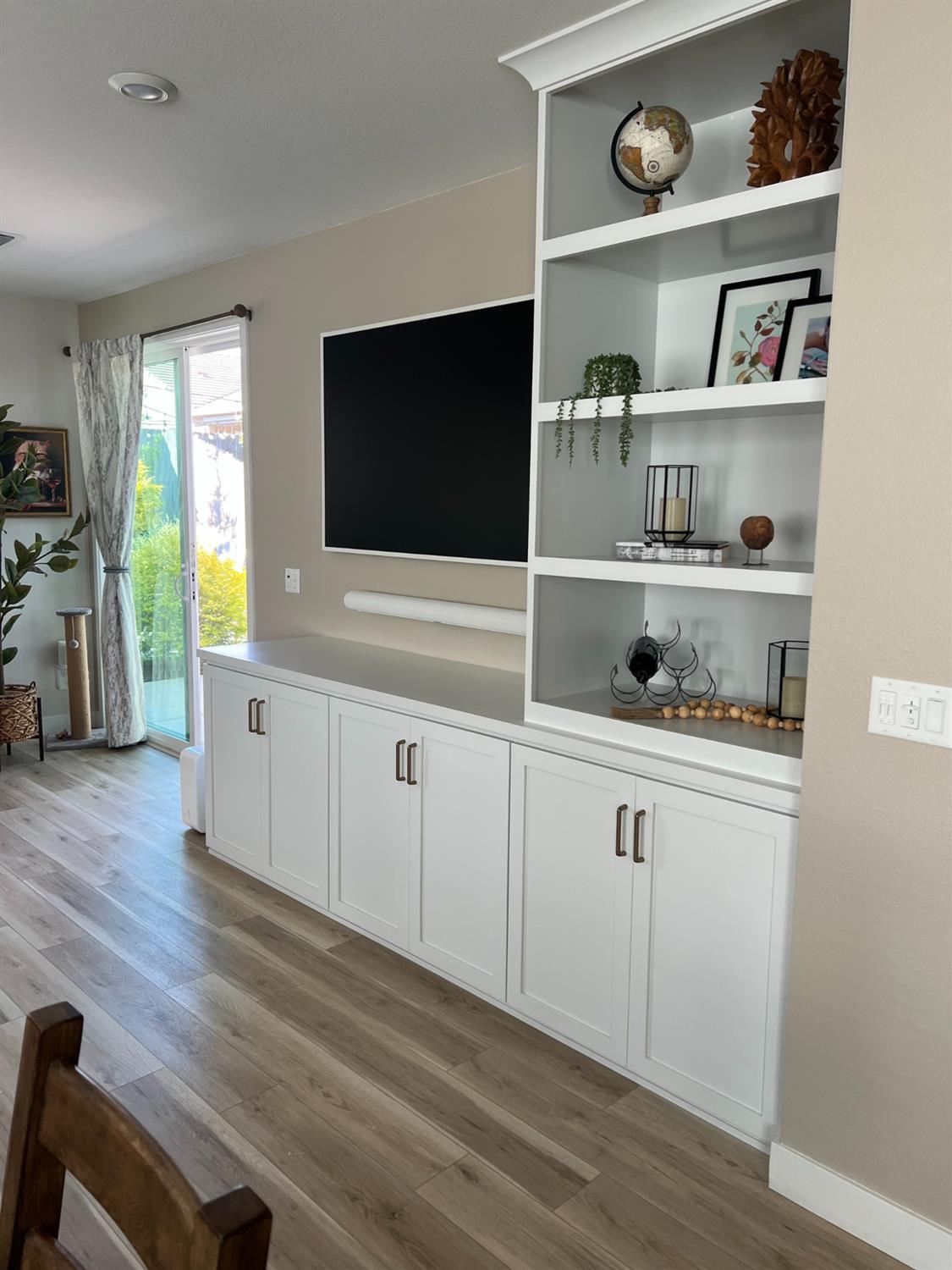 720 Riley Way Lincoln, CA 95648 - Photo 16 of 35 a living room with white cabinets and a flat screen tv