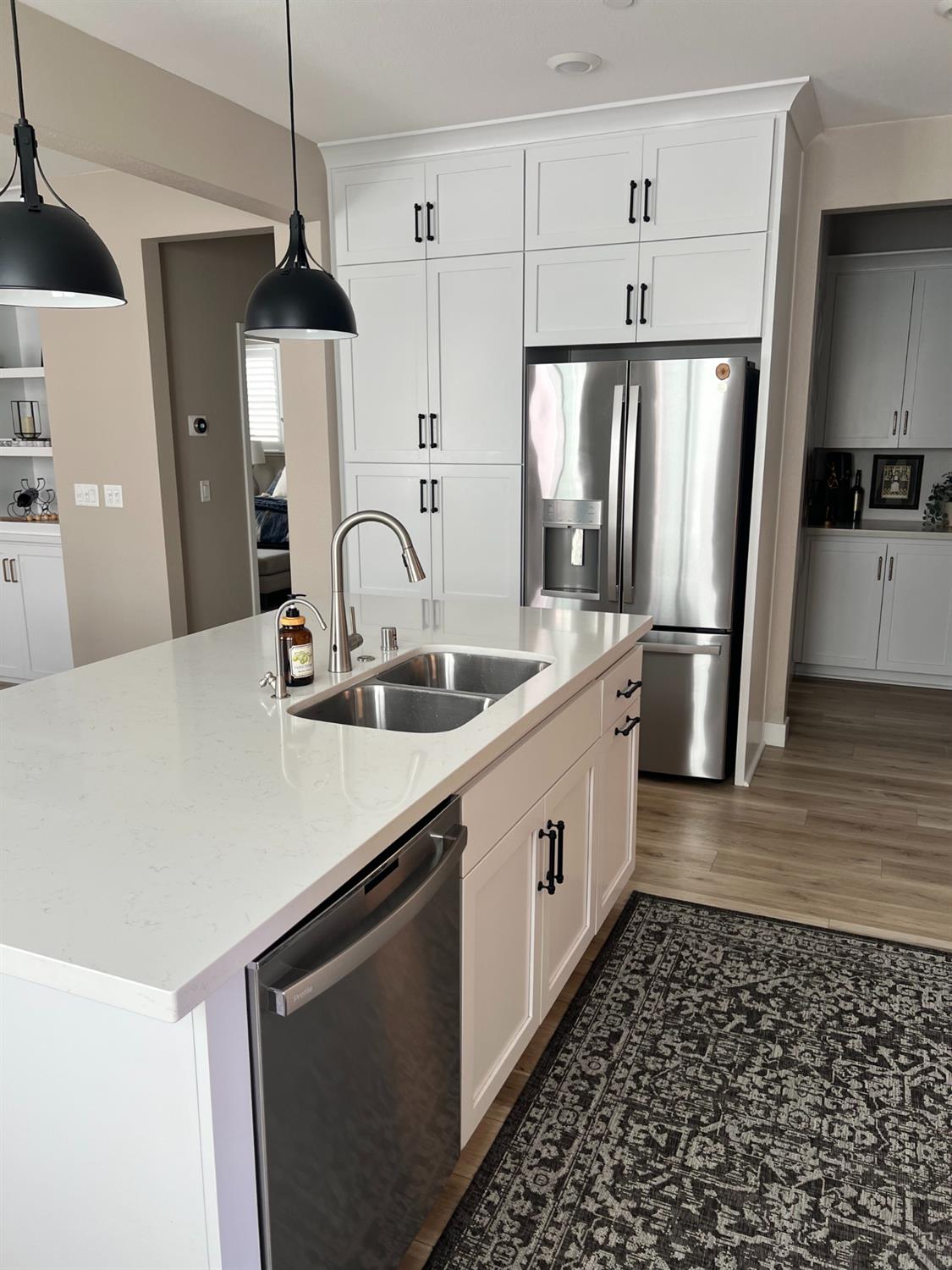 720 Riley Way Lincoln, CA 95648 - Photo 17 of 35 a kitchen with stainless steel appliances a sink a stove a refrigerator and cabinets