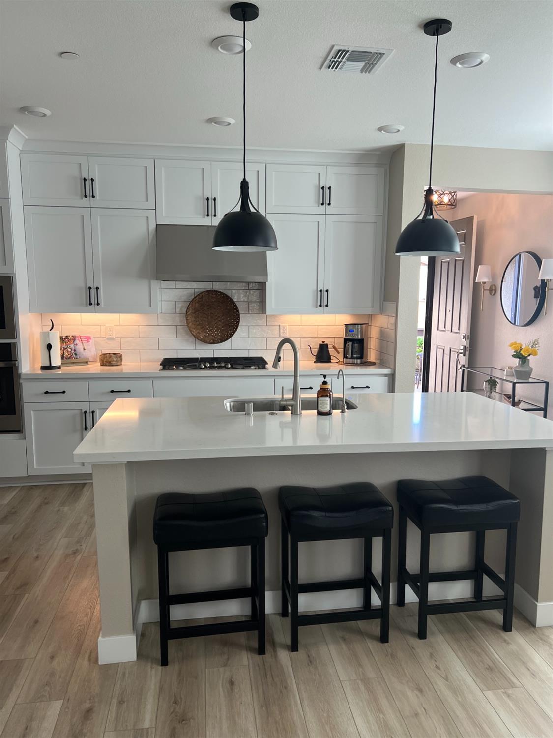 720 Riley Way Lincoln, CA 95648 - Photo 18 of 35 a kitchen with a table and chairs in it