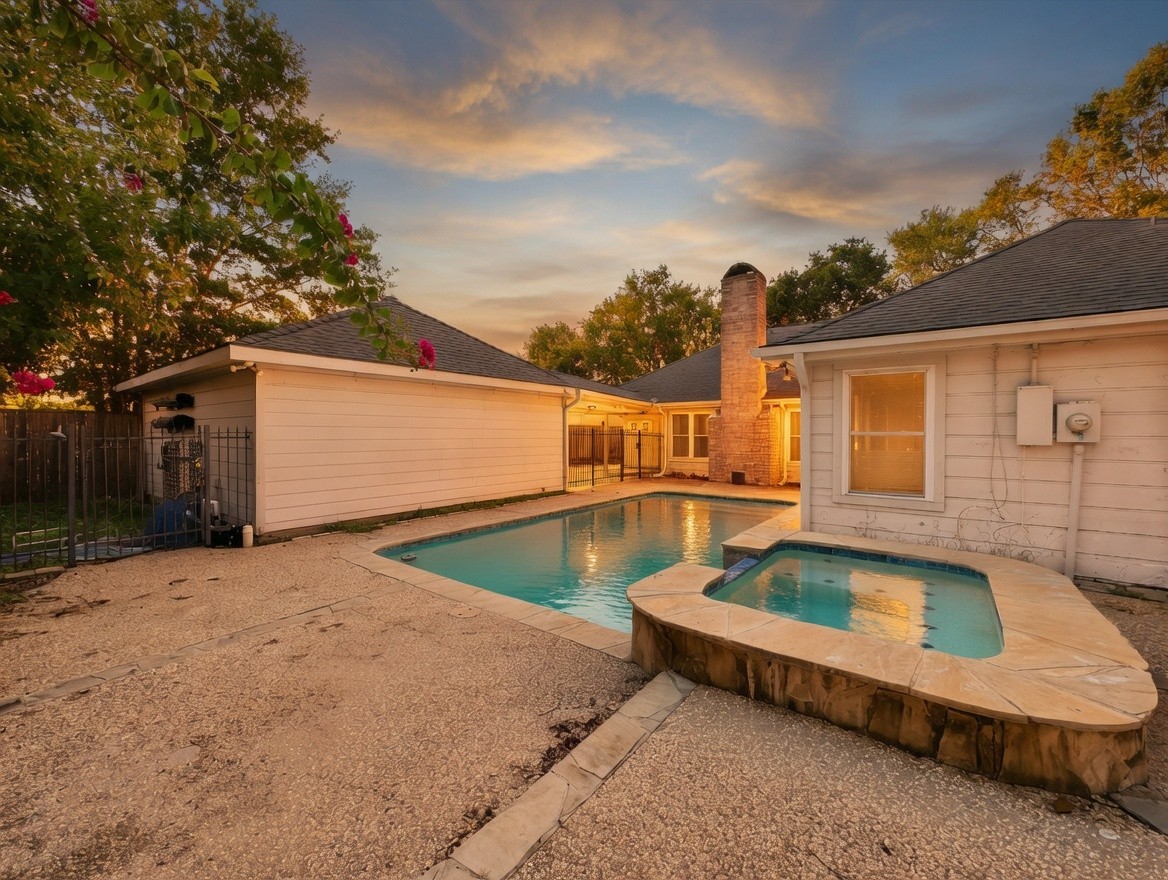 7914 Candle Lane Houston, TX 77071 - Photo 12 of 44 a front view of a house with swimming pool