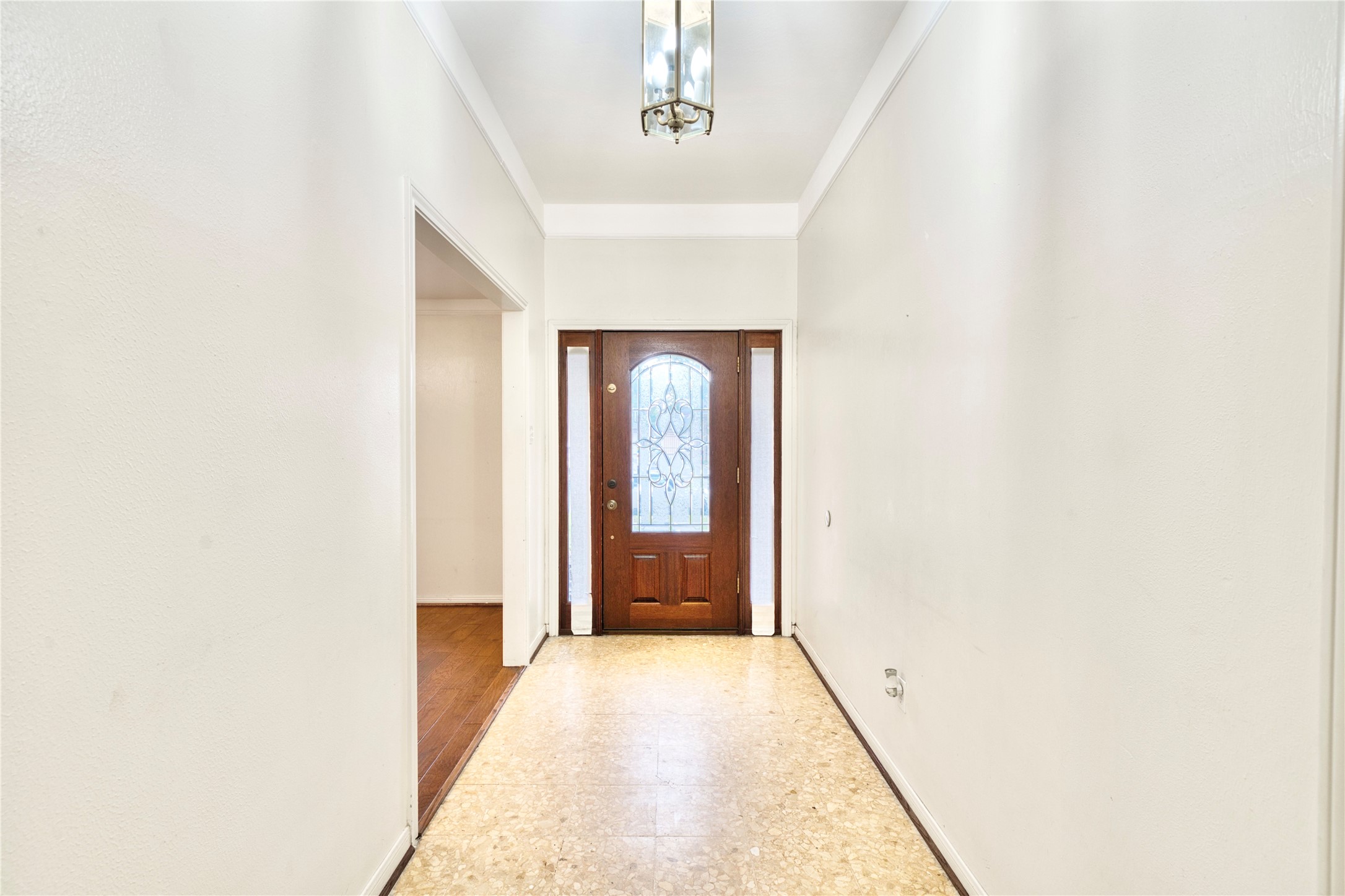 7914 Candle Lane Houston, TX 77071 - Photo 23 of 44 a view of a hallway with wooden floor
