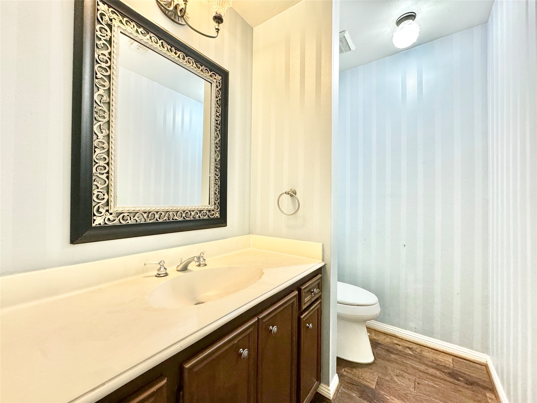 7914 Candle Lane Houston, TX 77071 - Photo 24 of 44 a bathroom with a sink a toilet and a mirror