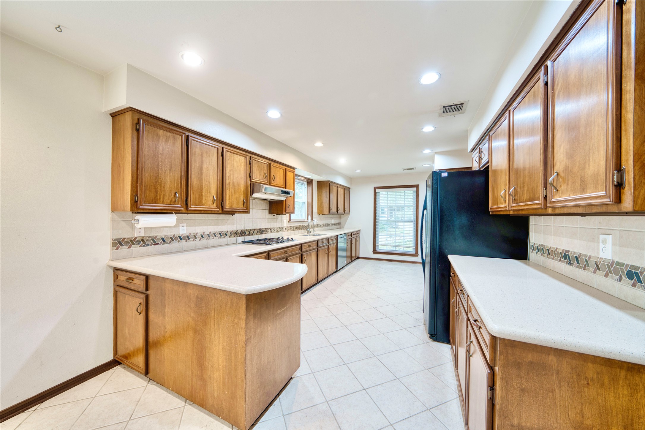 7914 Candle Lane Houston, TX 77071 - Photo 27 of 44 a kitchen with stainless steel appliances granite countertop a sink and cabinets
