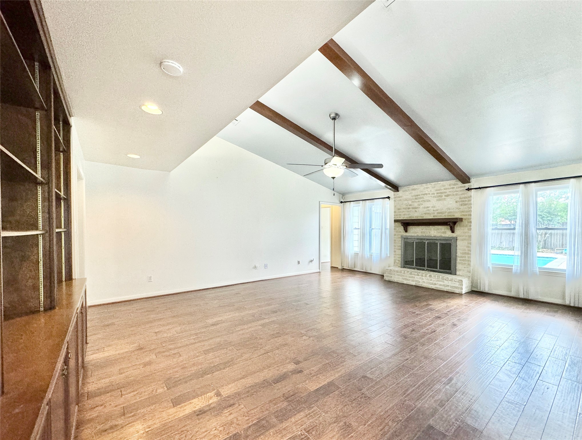7914 Candle Lane Houston, TX 77071 - Photo 29 of 44 a view of an empty room with wooden floor and a window