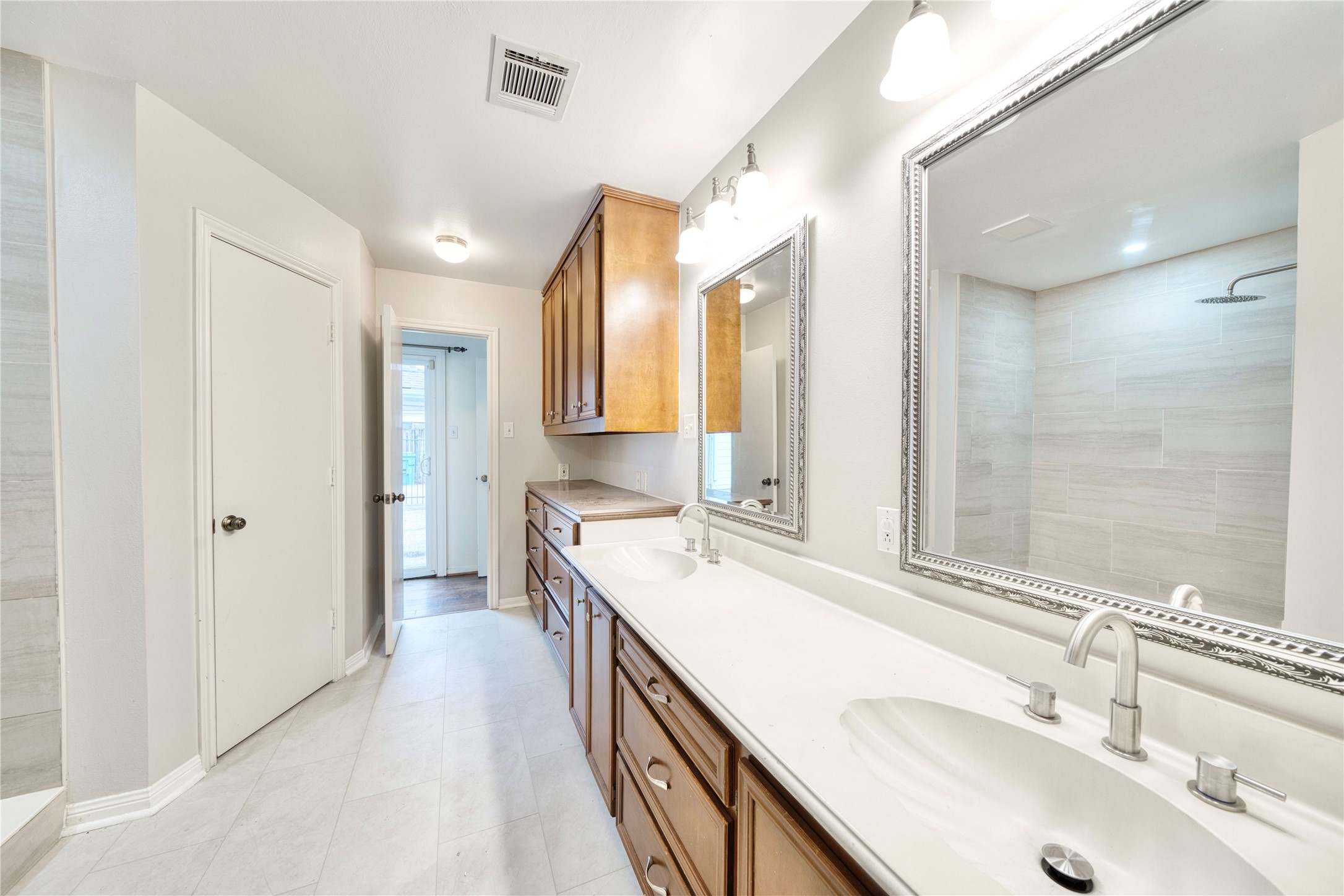 7914 Candle Lane Houston, TX 77071 - Photo 37 of 44 a bathroom with a sink double vanity granite and a mirror