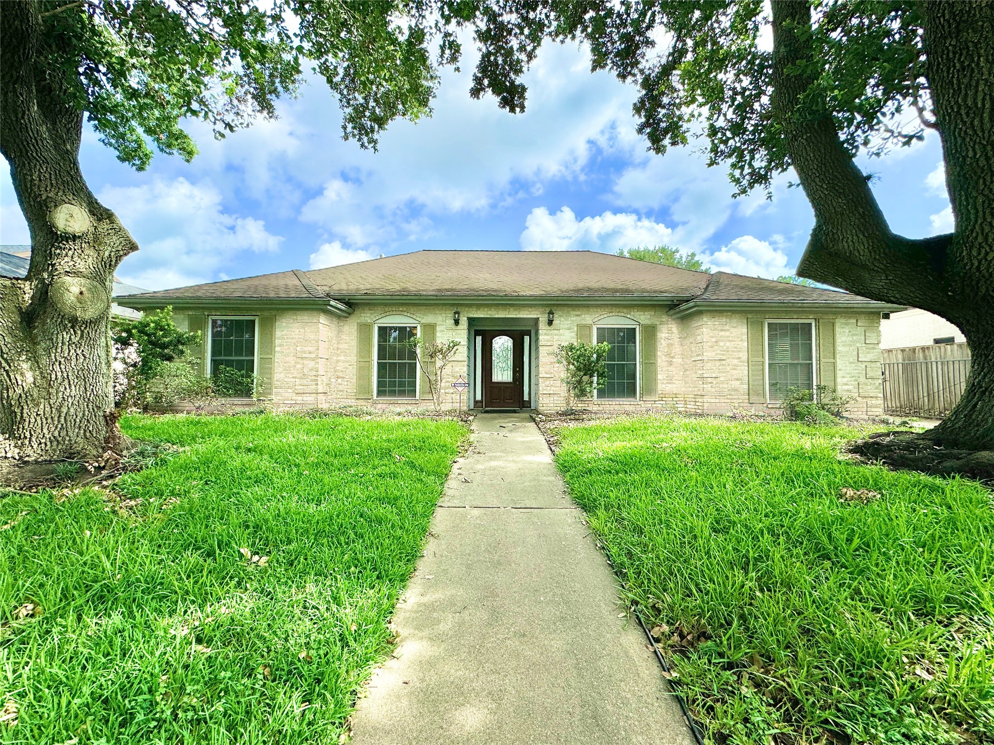 7914 Candle Lane Houston, TX 77071 - Photo 4 of 44 a view of a house with a yard