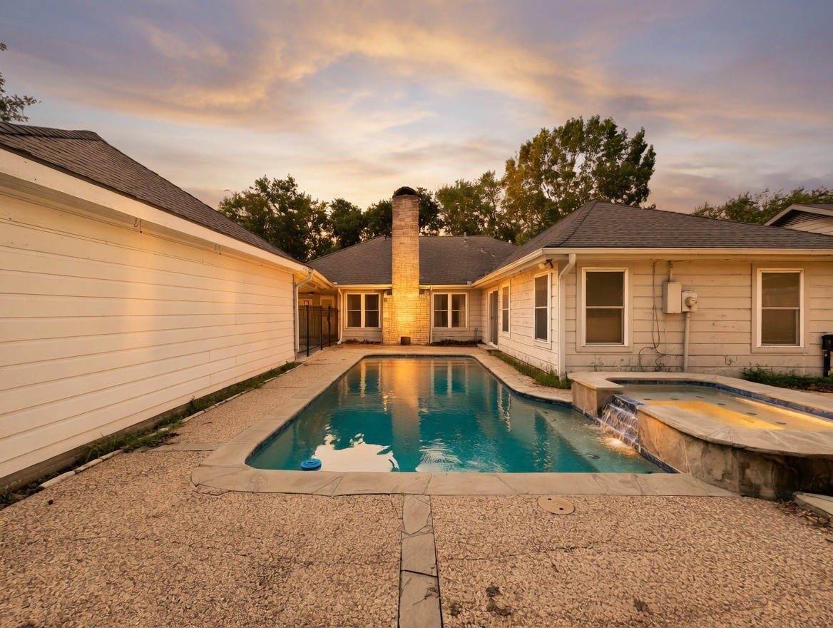 7914 Candle Lane Houston, TX 77071 - Photo 8 of 44 a front view of house with swimming pool and yard
