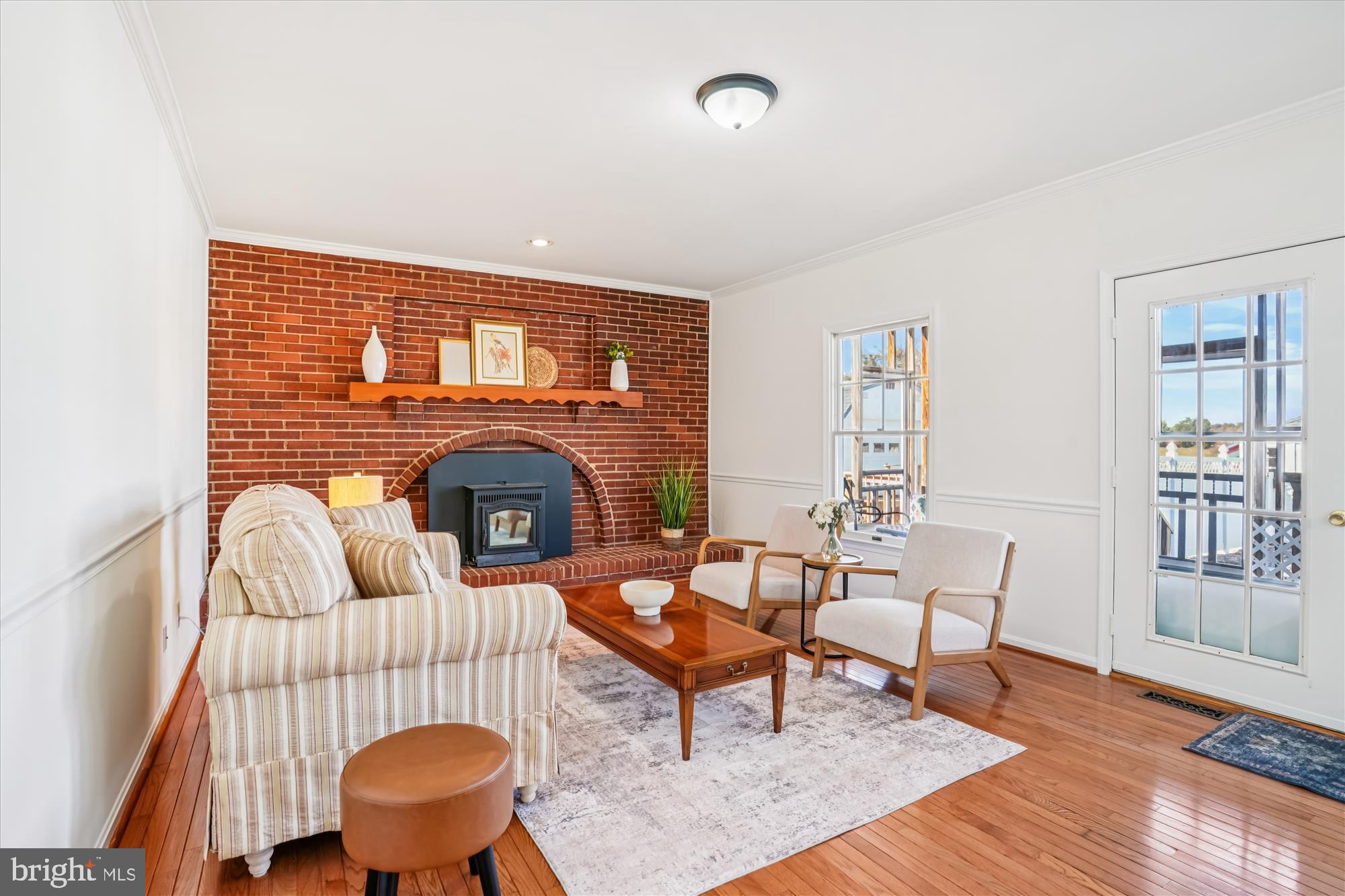 7951 Olivers Shop Road La Plata, MD 20646 - Photo 12 of 32 a living room with furniture a rug and a fireplace