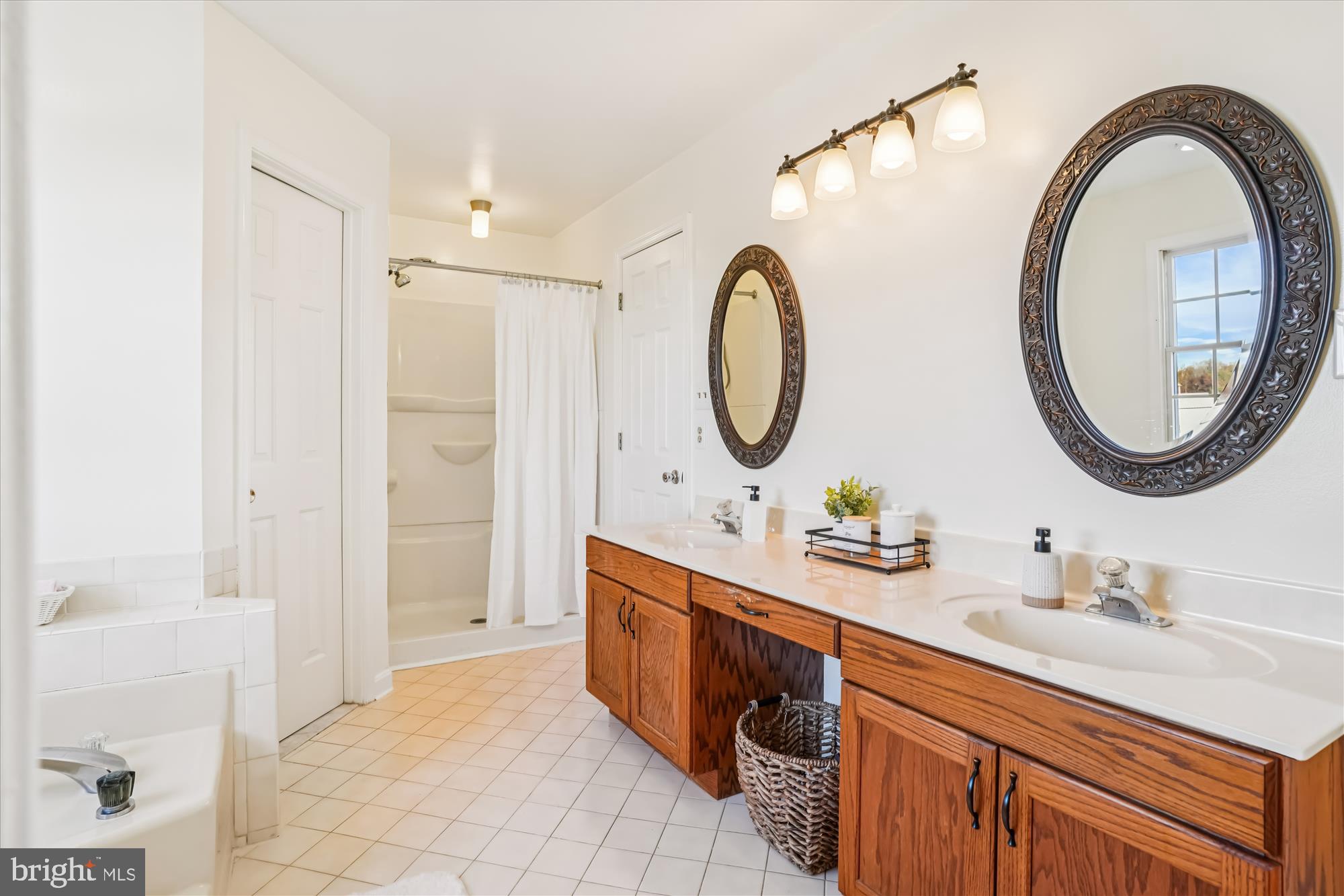 7951 Olivers Shop Road La Plata, MD 20646 - Photo 20 of 32 a bathroom with a sink and a mirror