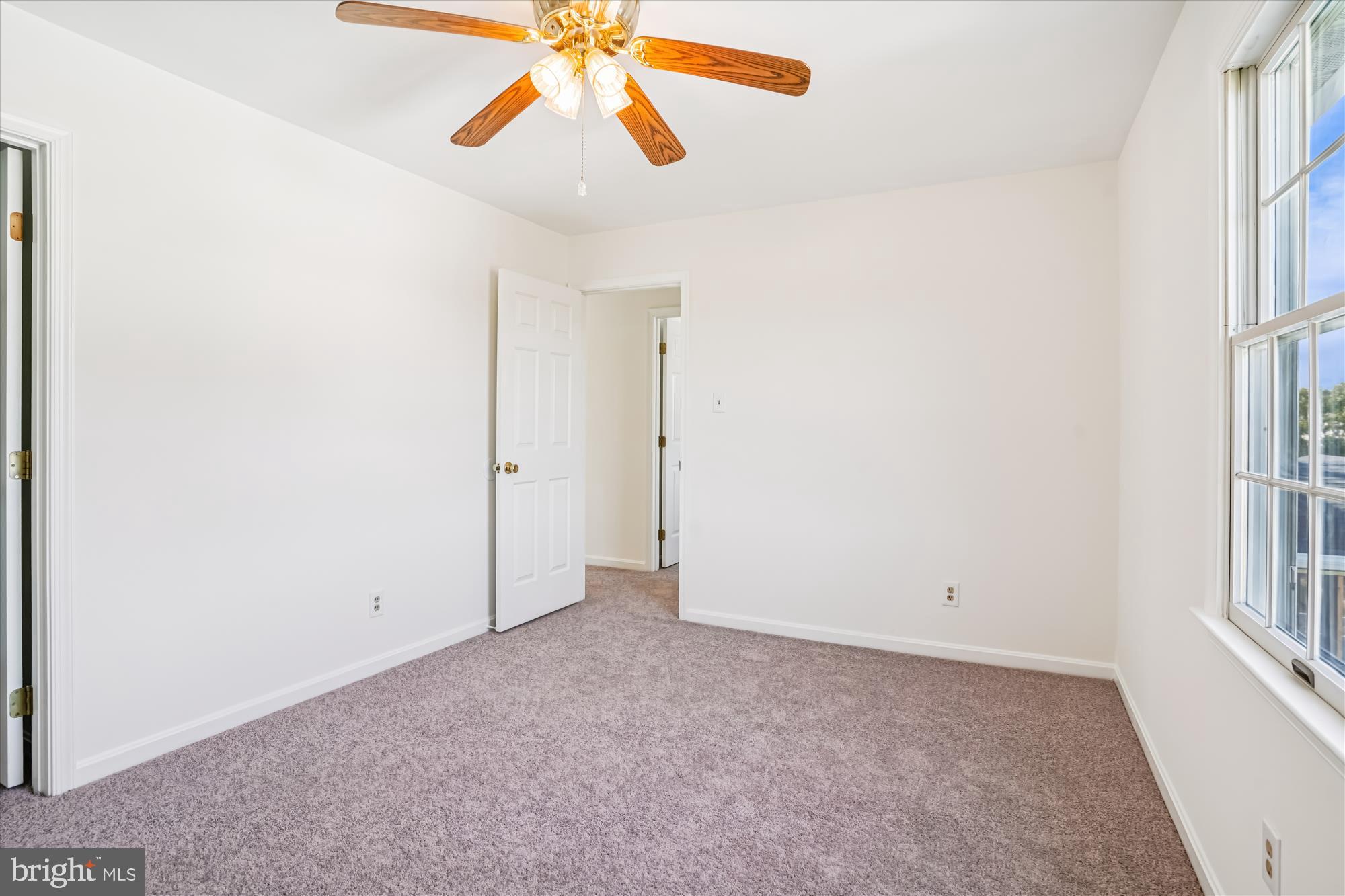 7951 Olivers Shop Road La Plata, MD 20646 - Photo 25 of 32 an empty room with windows and fan