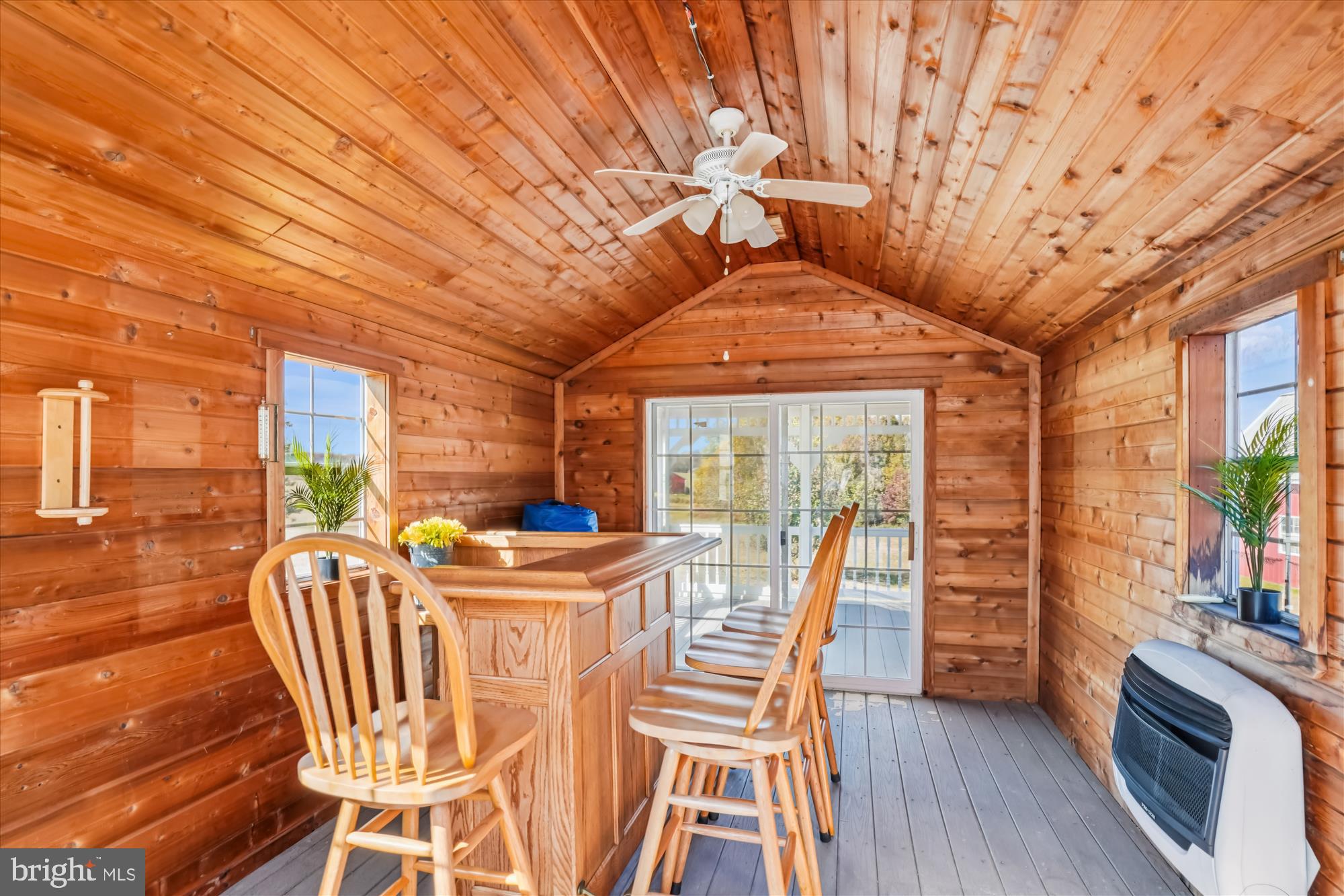 7951 Olivers Shop Road La Plata, MD 20646 - Photo 6 of 32 a dining room with furniture a fireplace and wooden floor
