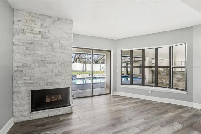a kitchen with stainless steel appliances granite countertop a refrigerator and a stove