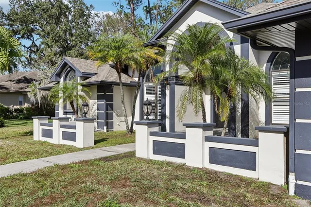 a view of house with outdoor space and swimming pool