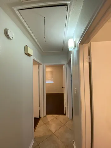 a view of a kitchen with furniture and a chandelier
