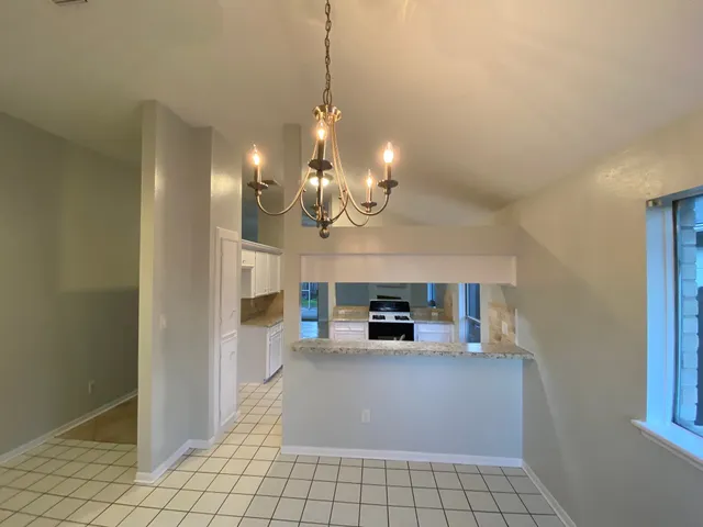 a view of a hallway with cabinet