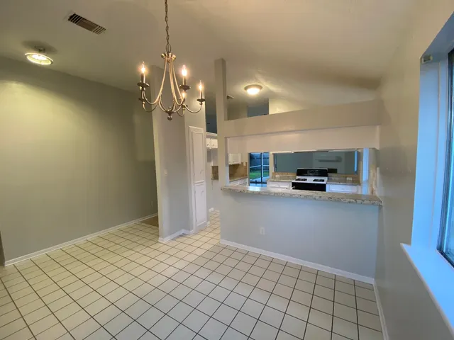 a kitchen with a stove and a sink