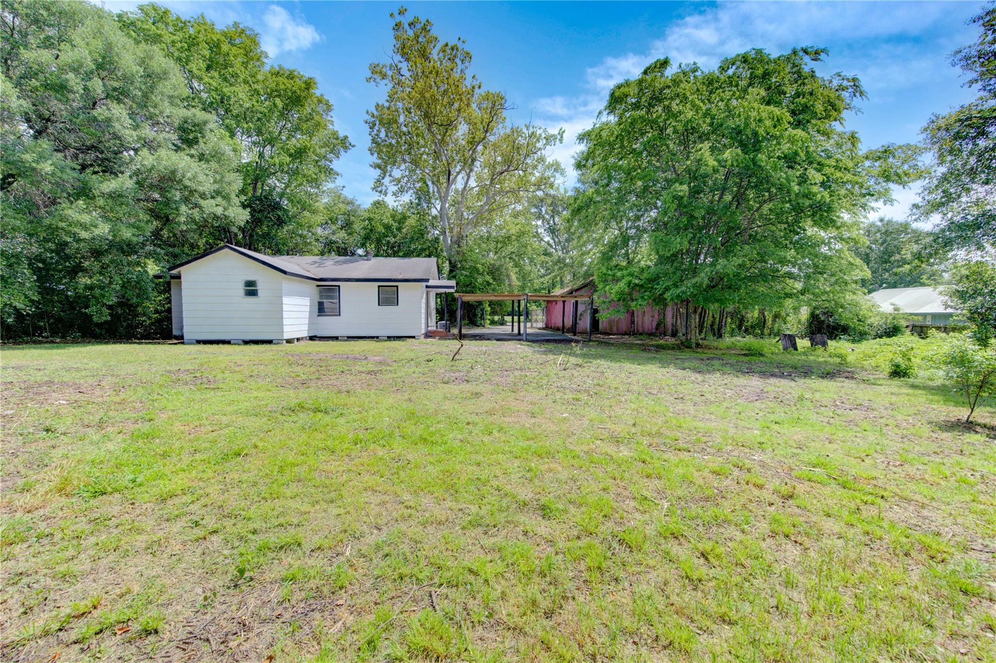 808 State Highway Loop Goodrich, TX 77335 - Photo 11 of 45 a house that has a tree in front of it