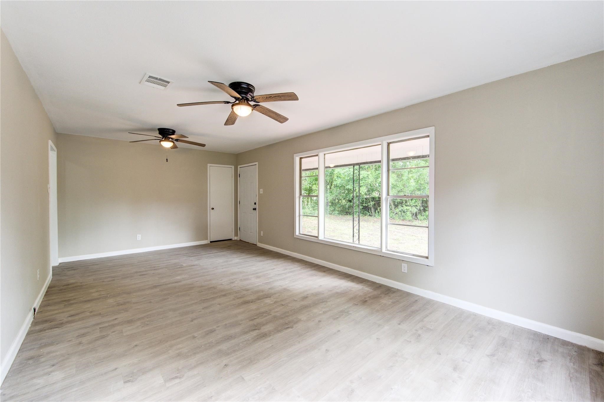 808 State Highway Loop Goodrich, TX 77335 - Photo 16 of 45 a view of a room with a ceiling fan and window
