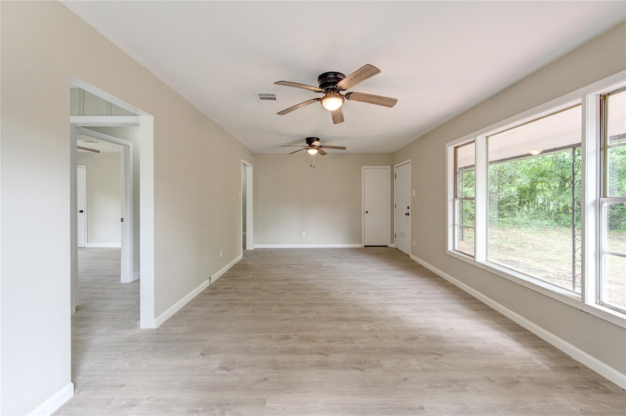 808 State Highway Loop Goodrich, TX 77335 - Photo 17 of 45 a view of a livingroom with a ceiling fan and window