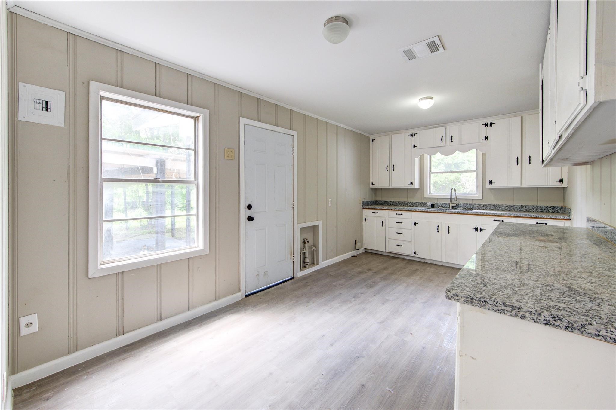 808 State Highway Loop Goodrich, TX 77335 - Photo 19 of 45 a view of a kitchen with granite countertop cabinets and a window
