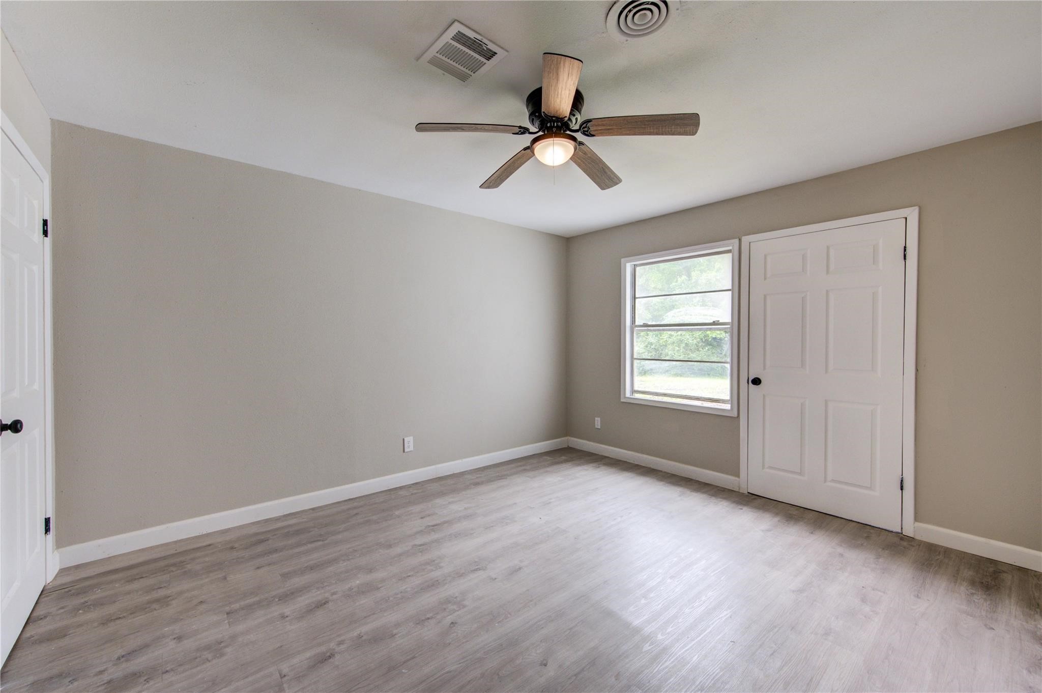 808 State Highway Loop Goodrich, TX 77335 - Photo 33 of 45 a view of an empty room with a window
