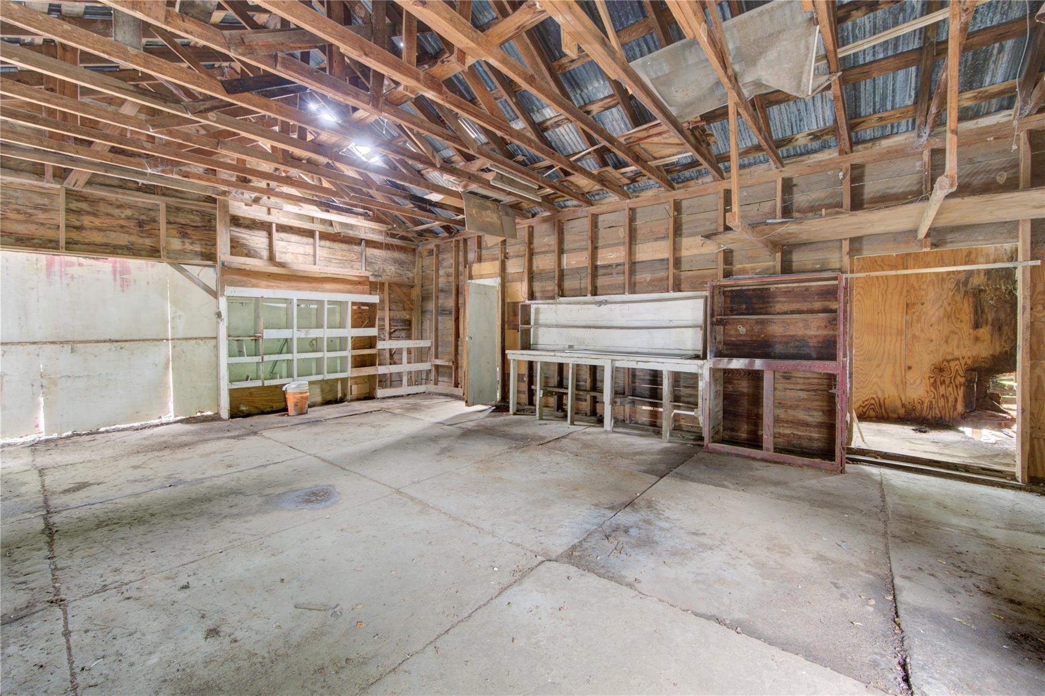 808 State Highway Loop Goodrich, TX 77335 - Photo 43 of 45 a view of an empty room with a brick wall
