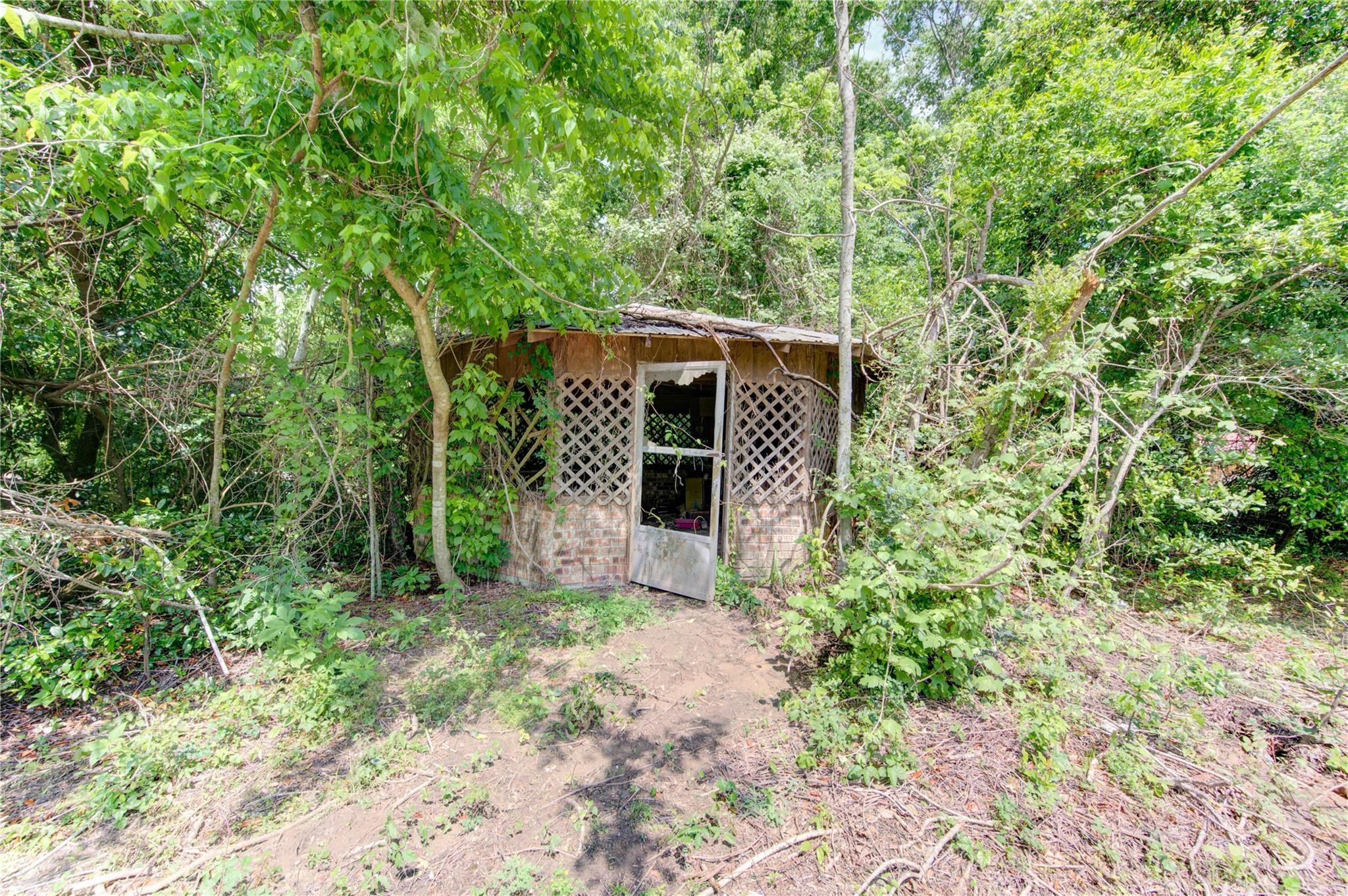 808 State Highway Loop Goodrich, TX 77335 - Photo 44 of 45 a front view of a house with garden