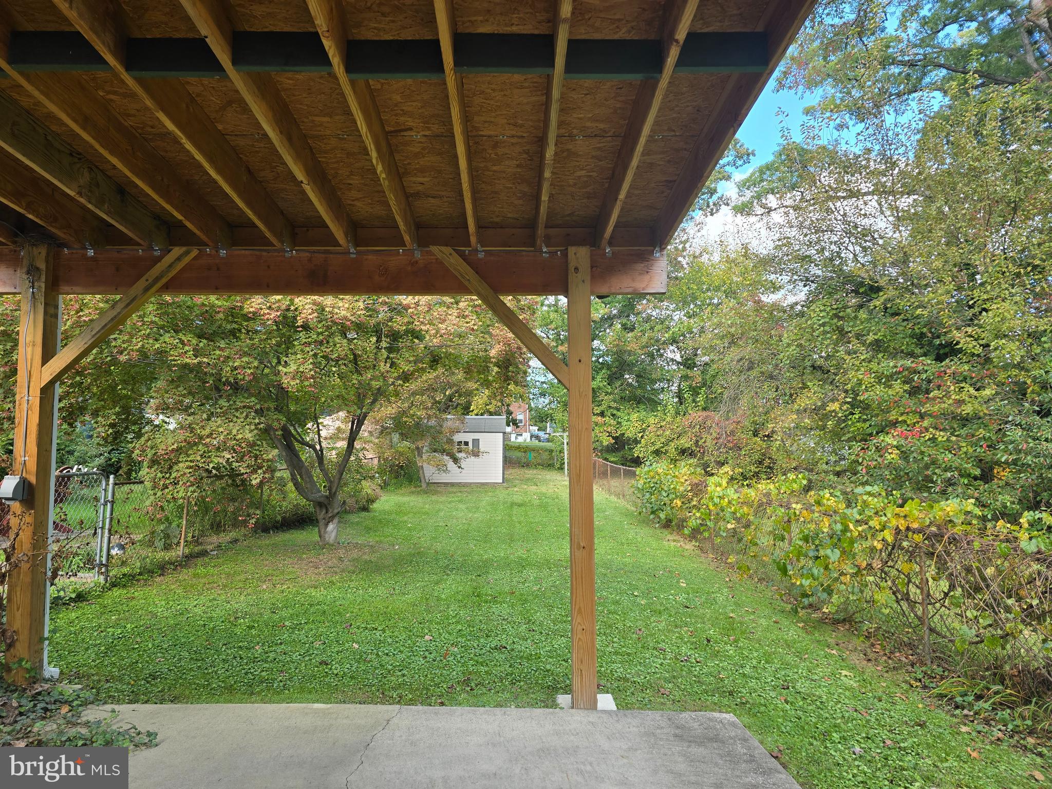 1666 Mussula Road Towson, MD 21286 - Photo 14 of 21 a backyard of a house with a garden and outdoor seating