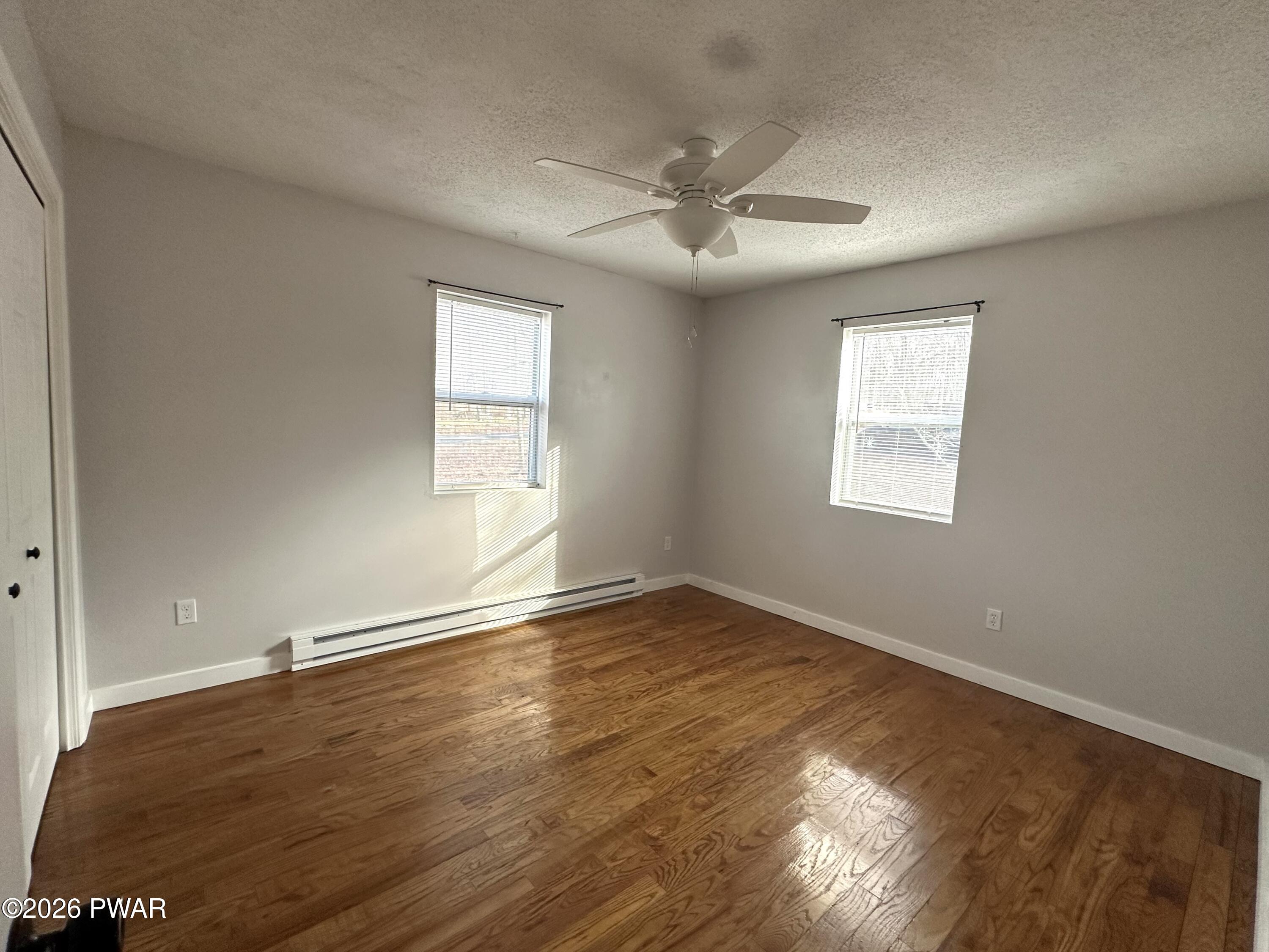 2116 Spring Drive Bushkill, PA 18324 - Photo 8 of 19 a view of an empty room with wooden floor and a window