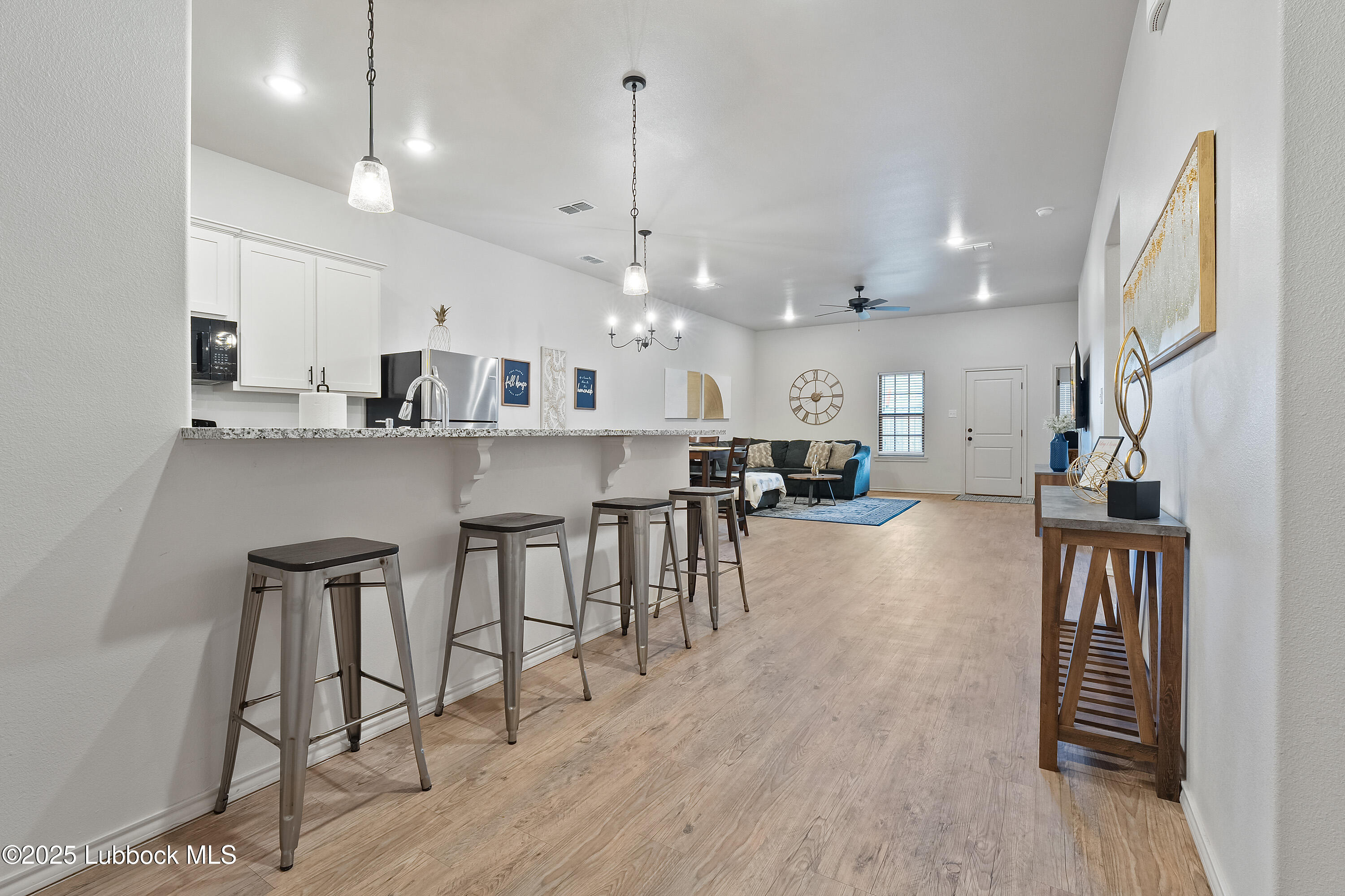 5526 Lehigh Street Lubbock, TX 79416 - Photo 4 of 23 a view of a kitchen and dining room