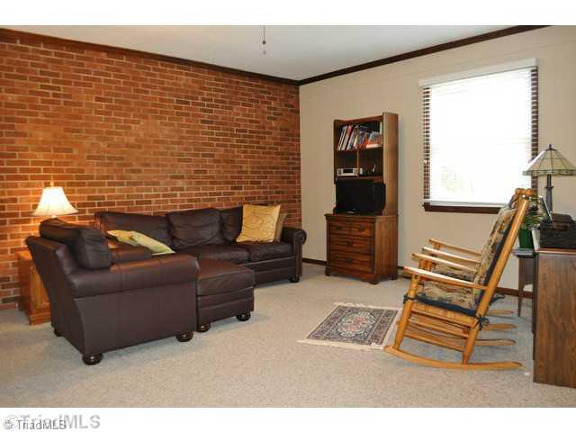 8704 Sweetmeadow Road Colfax, NC 27235 - Photo 4 of 16 Den/Family/Great Room. Large den, with ceiling fan is great for entertaining.