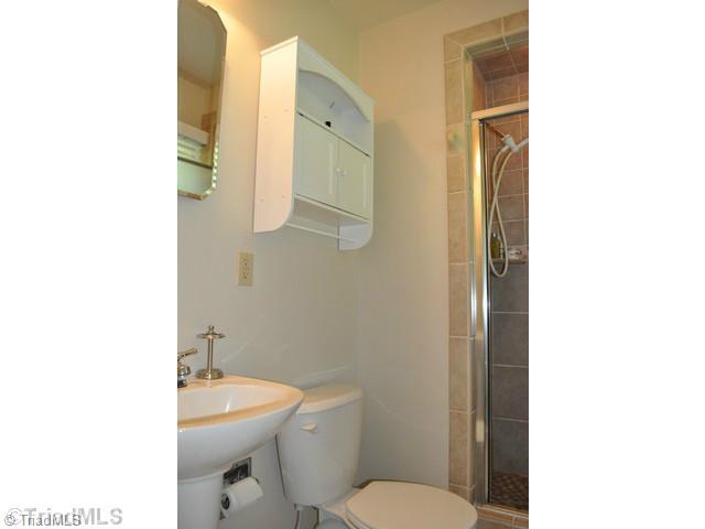 8704 Sweetmeadow Road Colfax, NC 27235 - Photo 9 of 16 Master Bath/Spa. Master bath with tiled shower.