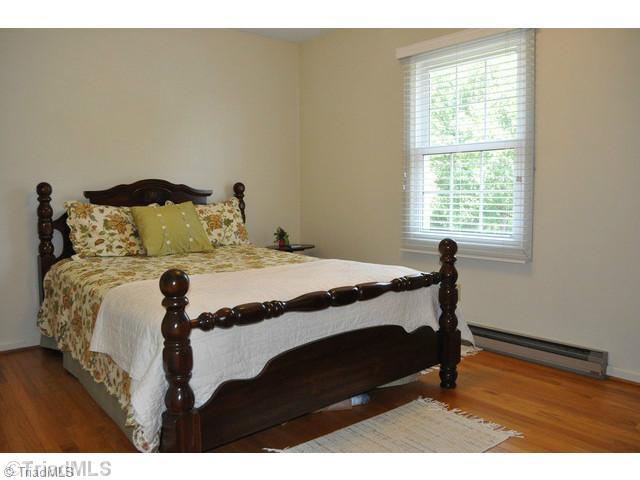 8704 Sweetmeadow Road Colfax, NC 27235 - Photo 10 of 16 2nd Bedroom. All bedrooms have hardwood floors.