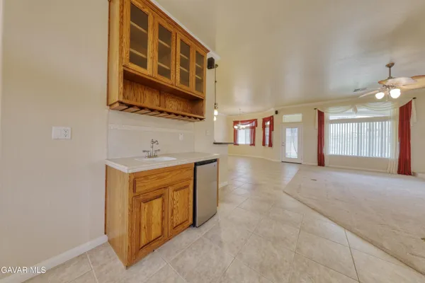 a view of a kitchen with granite countertop a large kitchen island in the center