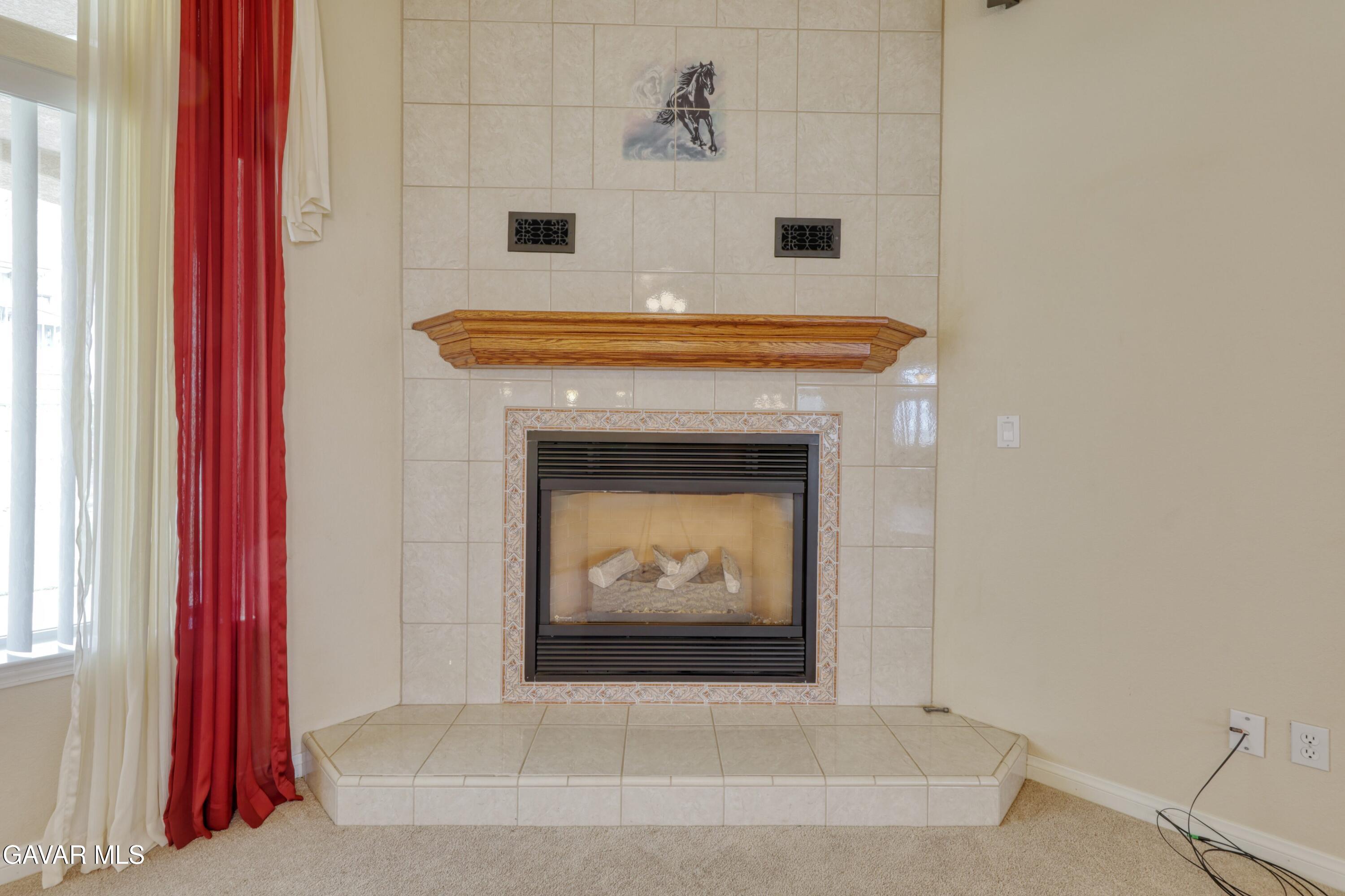 23780 Coyote Court Tehachapi, CA 93561 - Photo 13 of 48 a view of a hallway with a fireplace