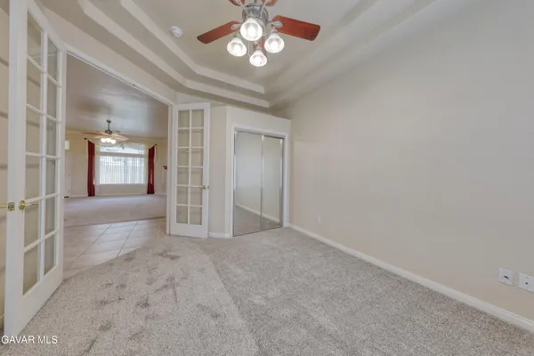 a spacious bathroom with a double vanity sink and a mirror