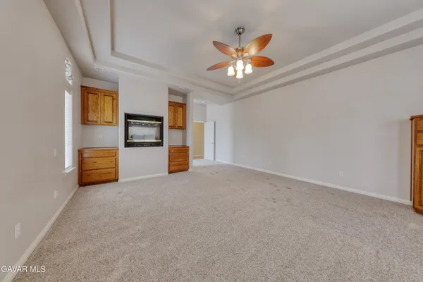 a bathroom with a granite countertop sink mirror vanity and toilet