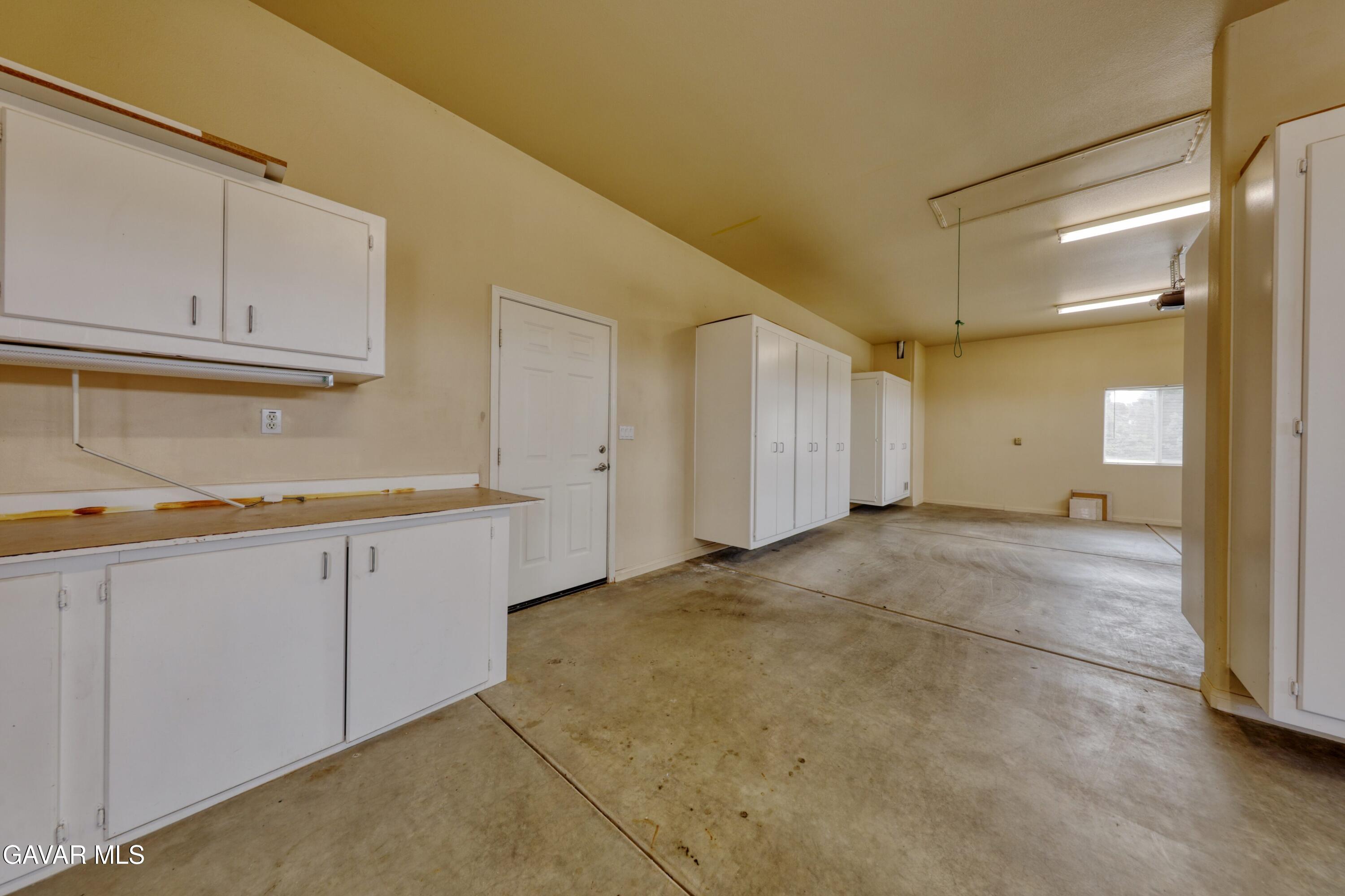 23780 Coyote Court Tehachapi, CA 93561 - Photo 44 of 48 a view of a kitchen with cabinets
