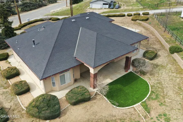 a living room with furniture flat screen tv and a fireplace