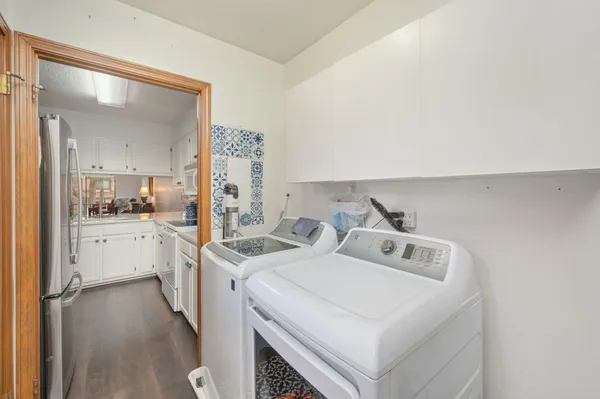 a view of kitchen sink and refrigerator