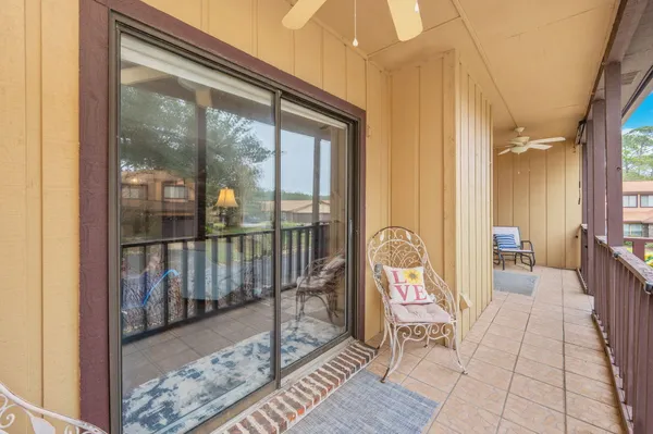 a view of a balcony with wooden floor