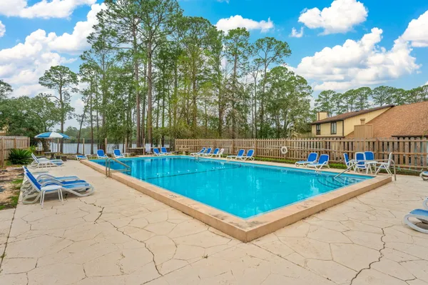 a view of a swimming pool with a lounge chair